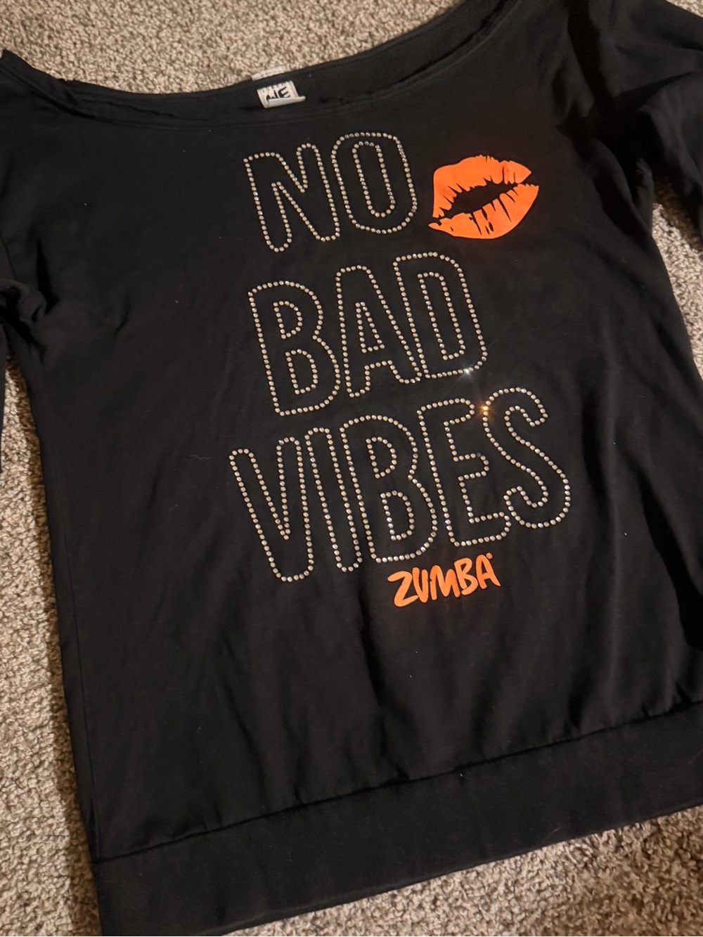 Zumba Black Tee with Orange Lip and Studded "No Bad Vibes"
